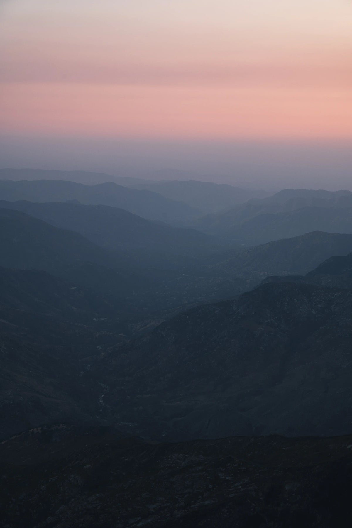 Layered Sierra Nevada ridgelines at sunset from Moro Rock in Sequoia National Park, California